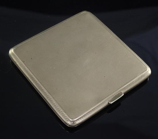 A 1920s engine turned 9ct gold square cigarette case, gross 97.3 grams.